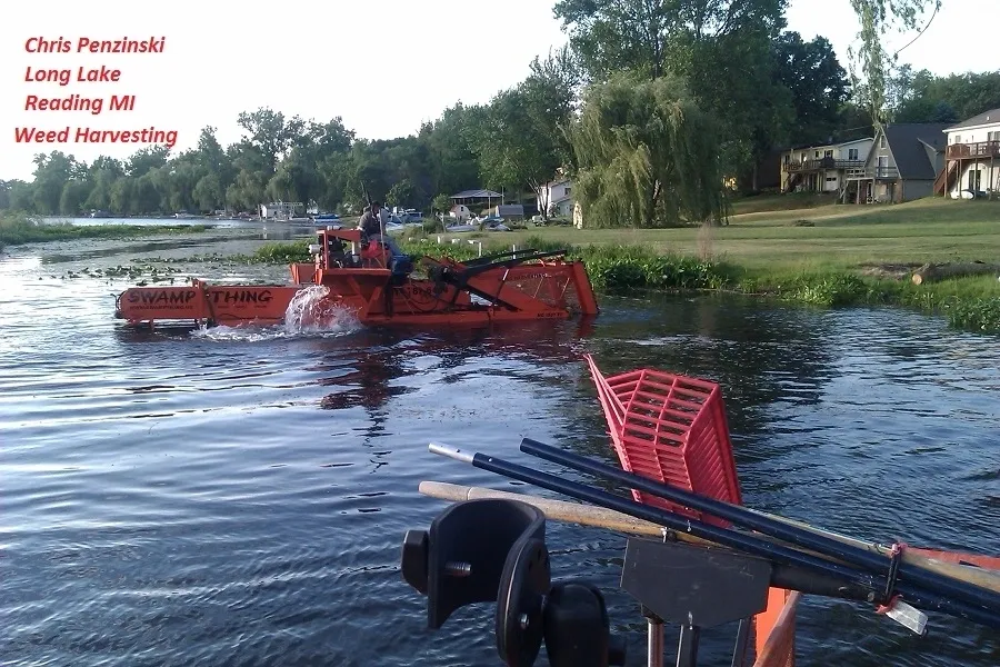 A boat is in the water with people on it.