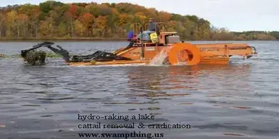 A large orange tractor in the water.