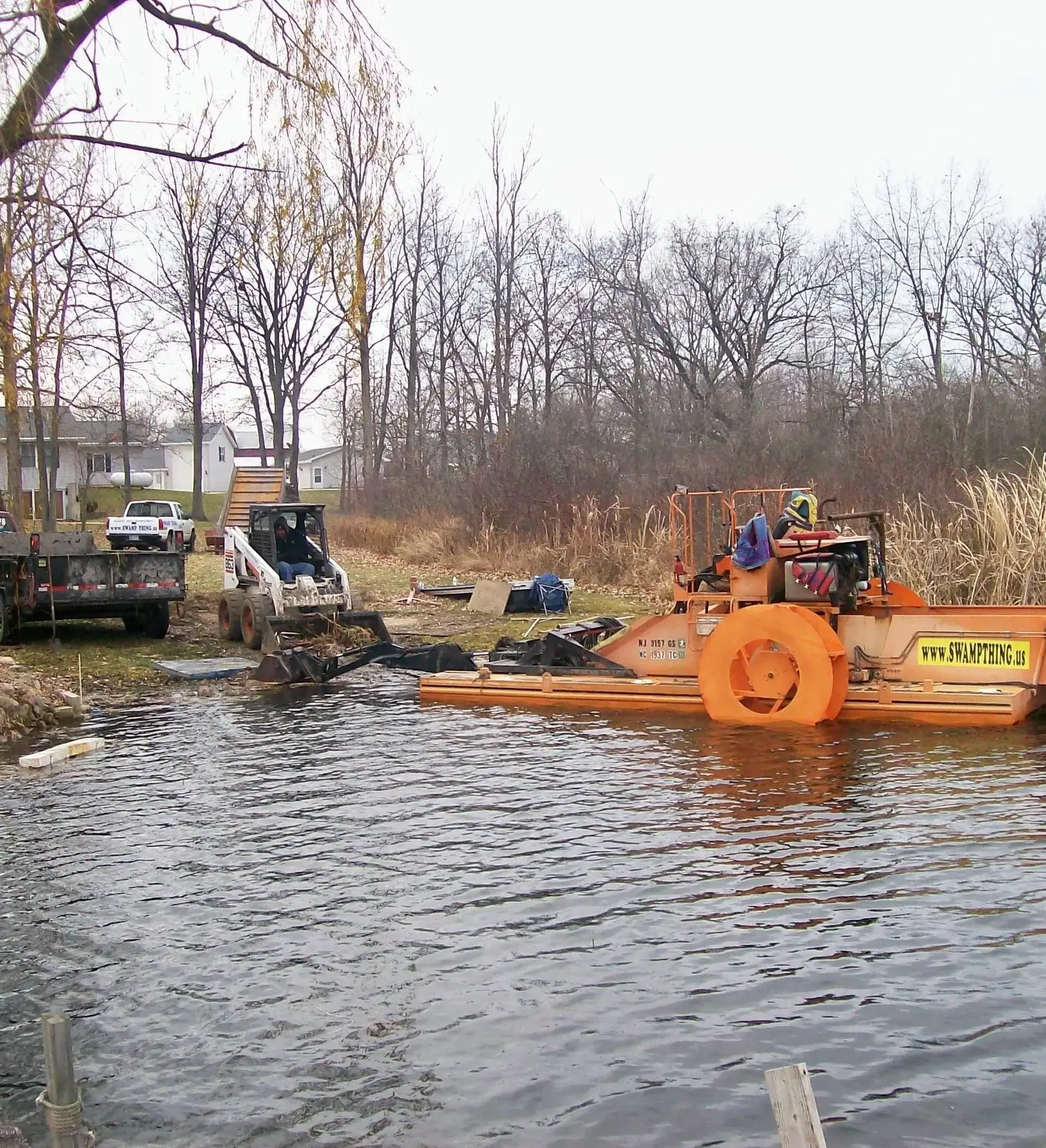 A large orange boat is in the water.