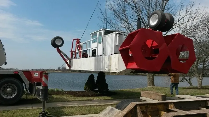 A large red boat is in the water.