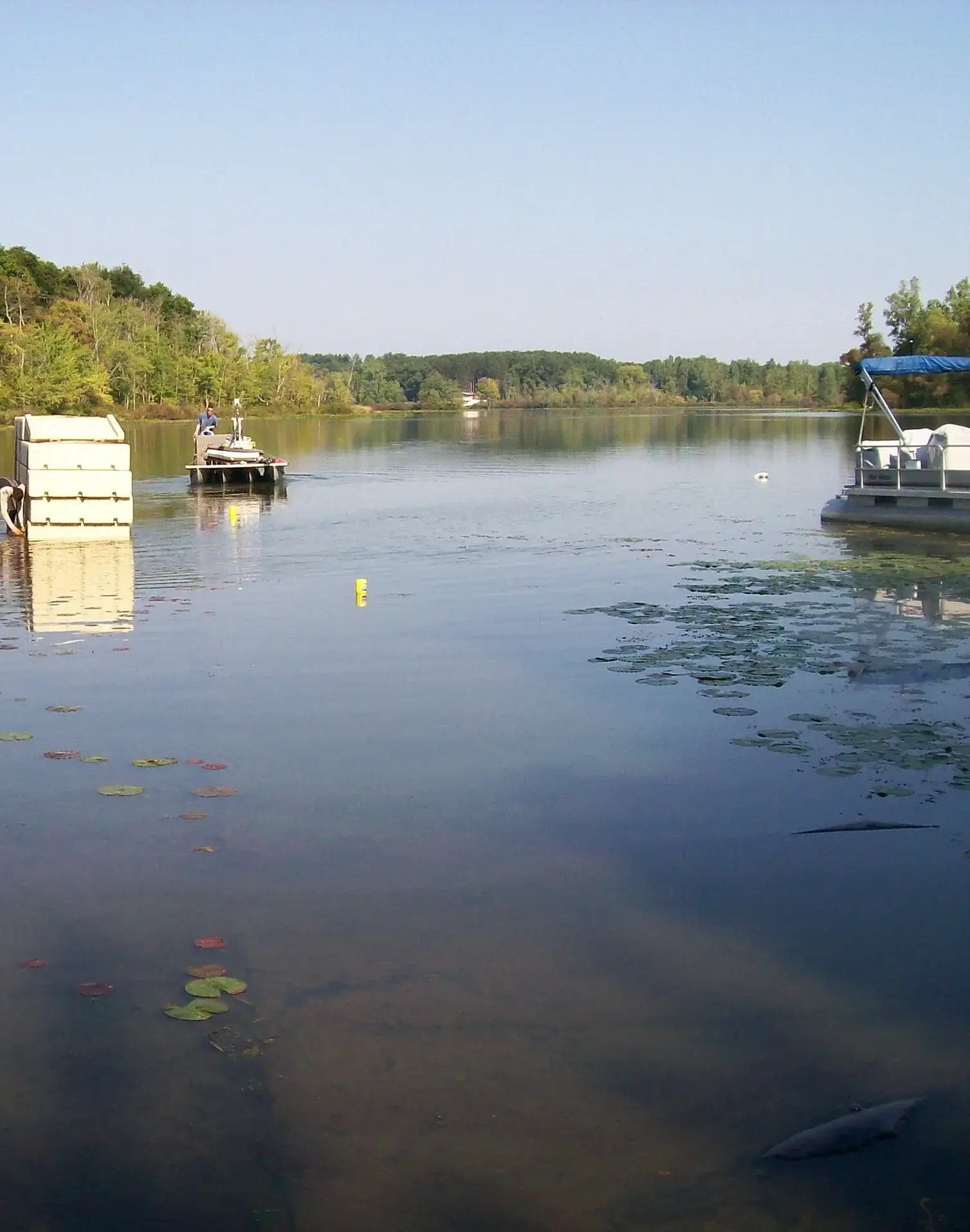 A body of water with boats floating on it.