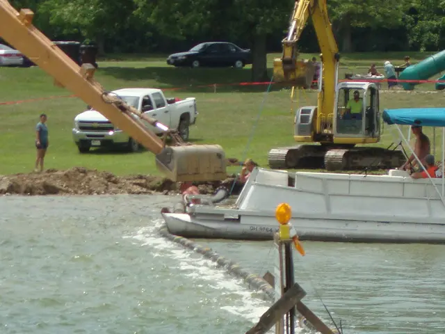 A boat is being loaded with sand and gravel.