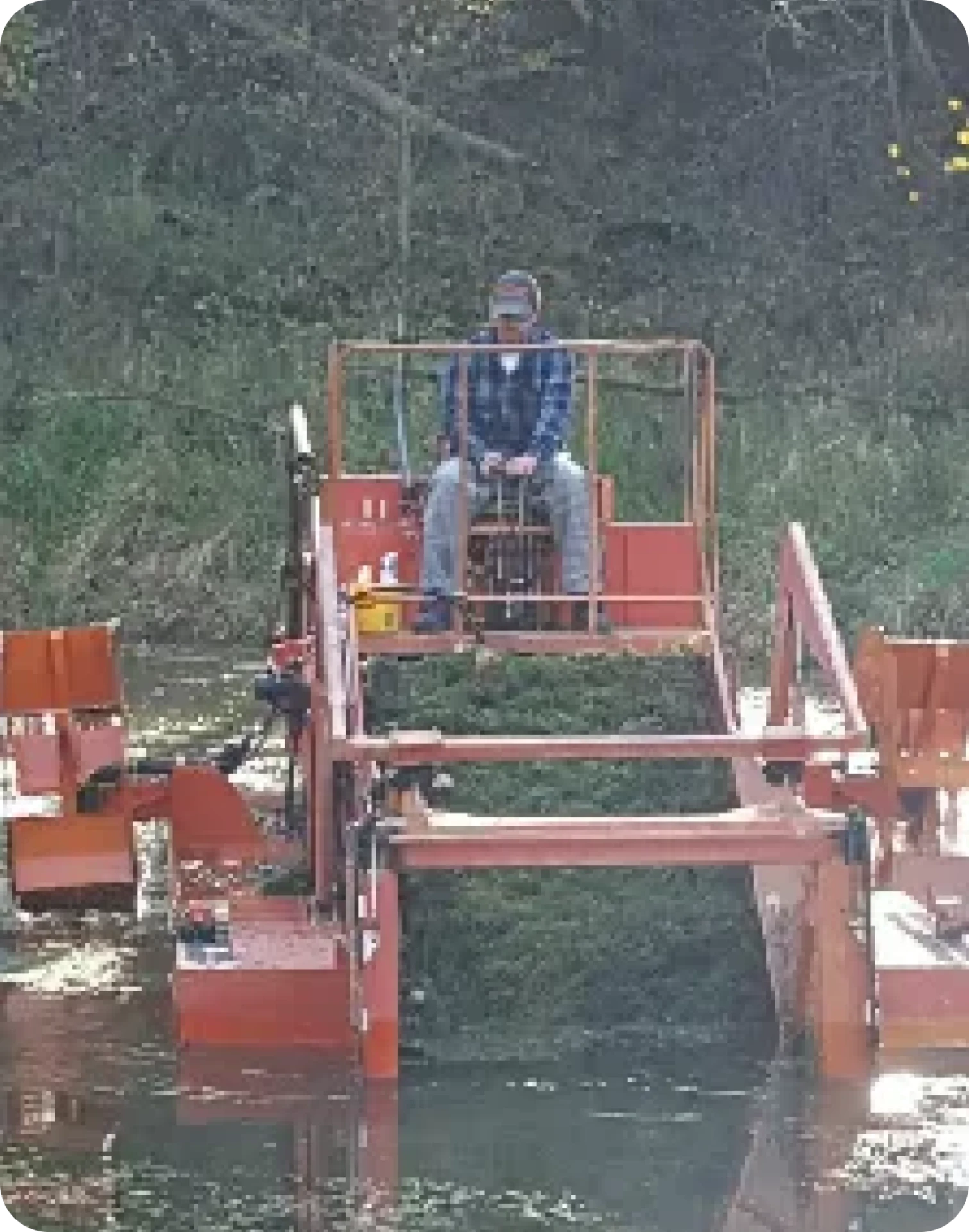 A man sitting on top of a boat in the water.