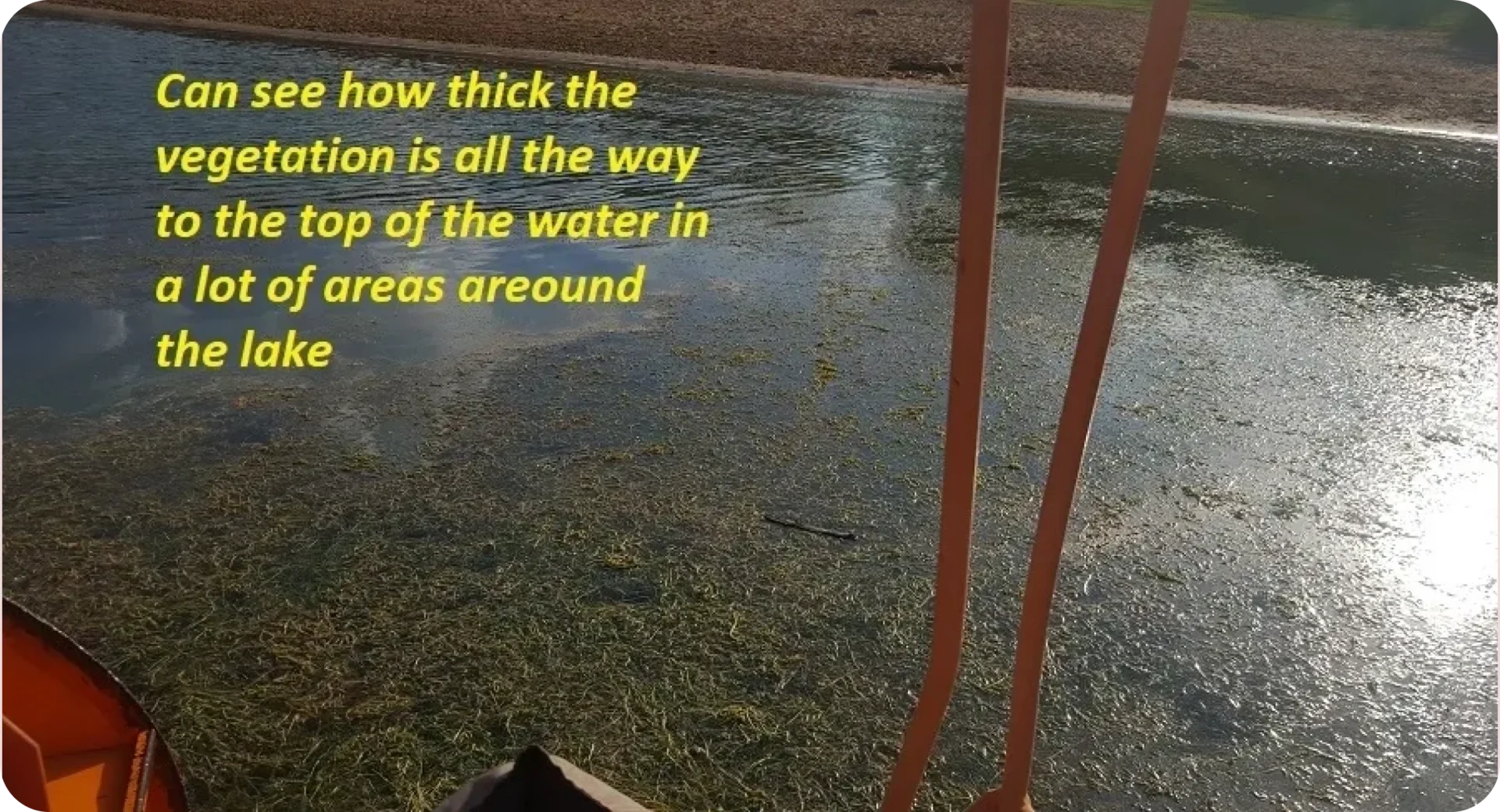 A boat is in the water with some writing on it.